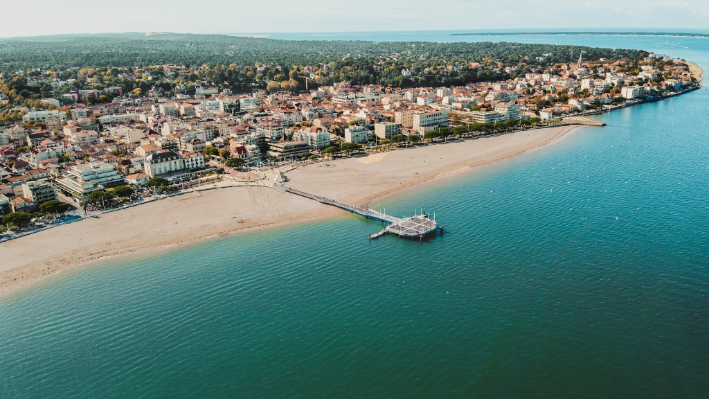 an aerial view of a beach and a city